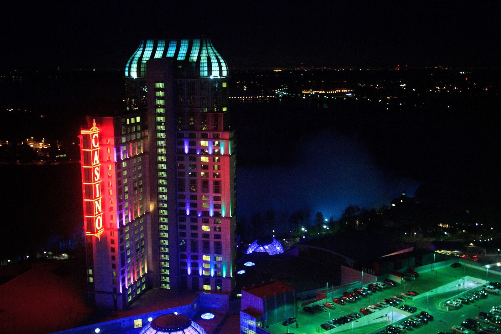 Fallsview Casino Resort lit up at night above Niagara Falls